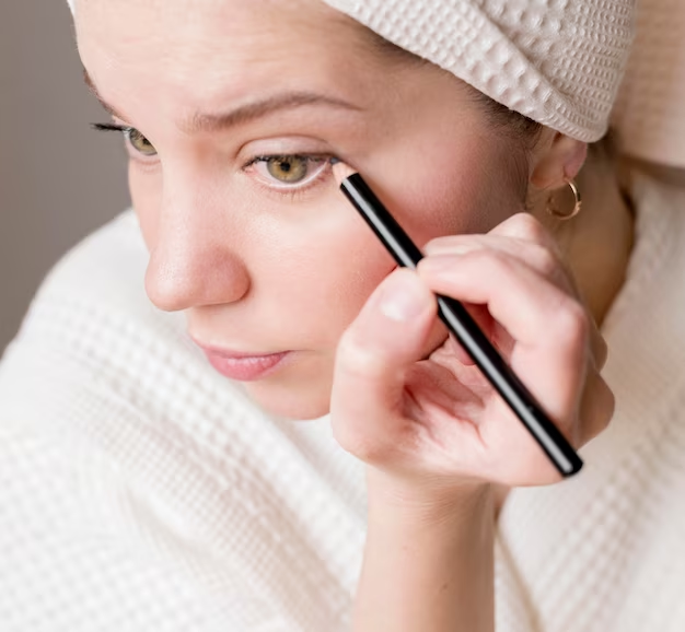 Applying mascara before false lashes for a natural look