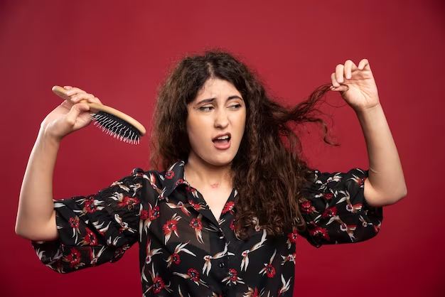Woman with tangled hair after brushing
